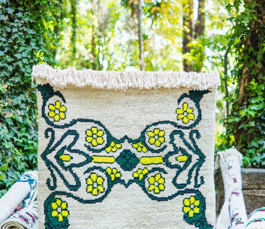 Deep green vines create a protective framework for bright yellow blossoms. It reimagines nature as an interconnected support system that thrives in freedom.